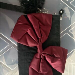 Kipling Black and Red Clutch with Elegant Bow Detail